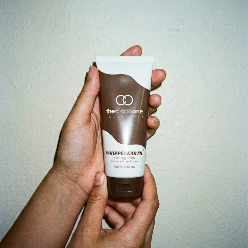 WHIPPEDEARTH® Clearing Polish held in two hands showing formula texture